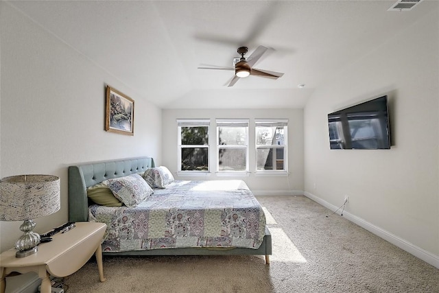 bedroom featuring visible vents, baseboards, carpet, vaulted ceiling, and a ceiling fan