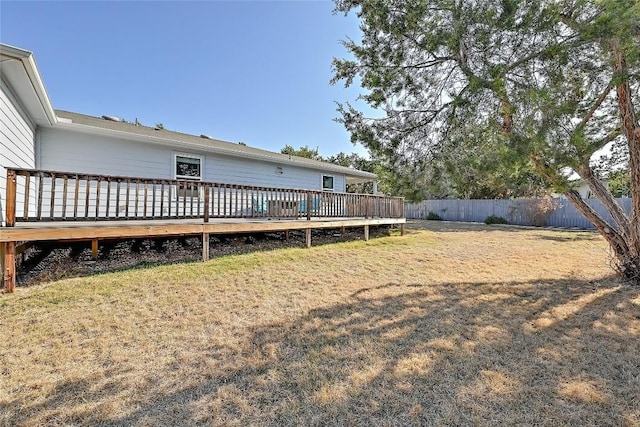 view of yard with a wooden deck and fence