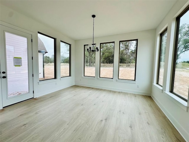 1670 Headwaters Blvd, Dripping Springs, TX 78620 - unfurnished sunroom featuring a chandelier and wood finished floors