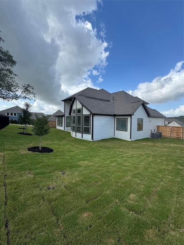 1670 Headwaters Blvd, Dripping Springs, TX 78620 - back of property with roof with shingles