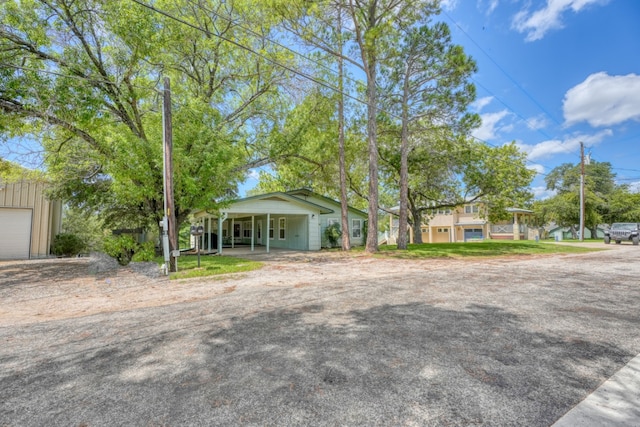 view of front of property with a porch and a garage