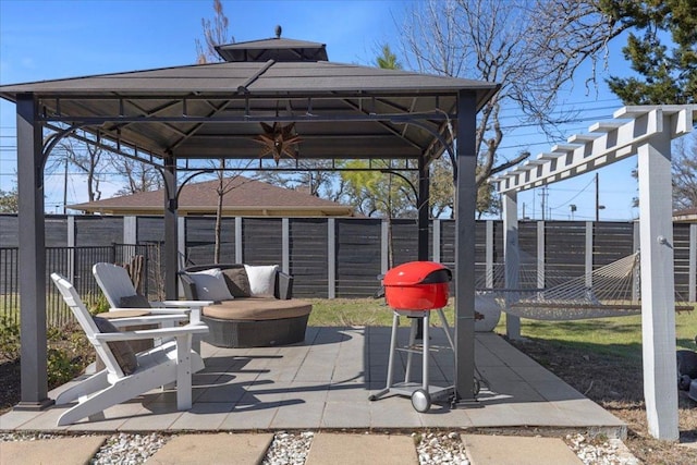 view of patio / terrace featuring a gazebo and a fenced backyard