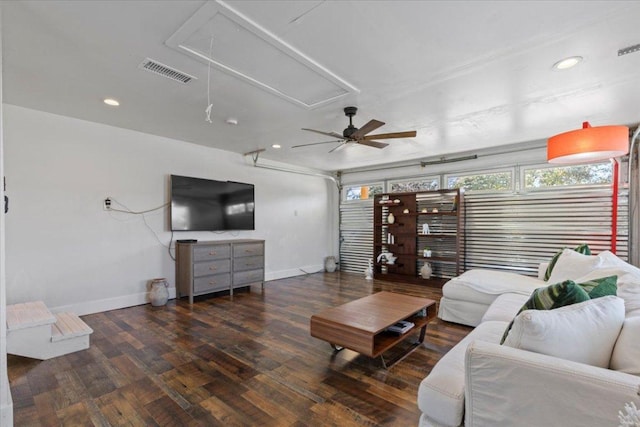 living area featuring wood finished floors, visible vents, baseboards, attic access, and recessed lighting