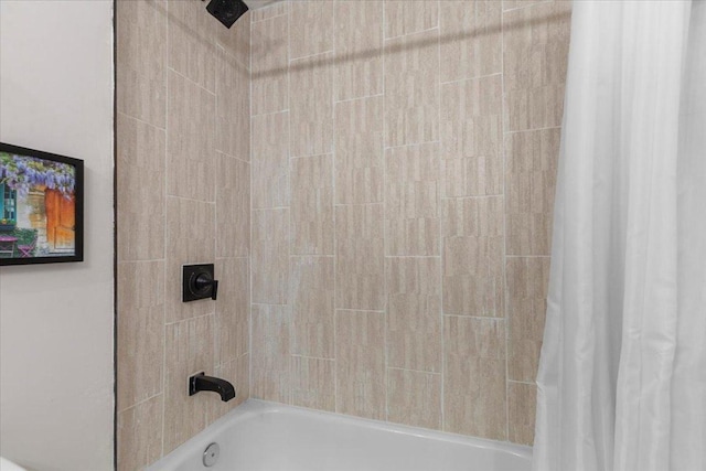 full bathroom with shower / tub combo with curtain