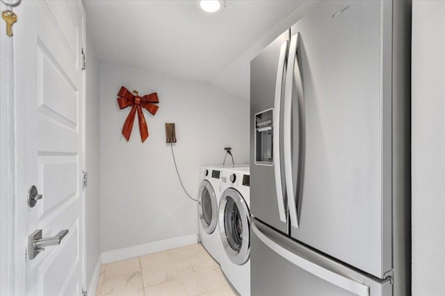 laundry room featuring baseboards, marble finish floor, laundry area, and washing machine and clothes dryer