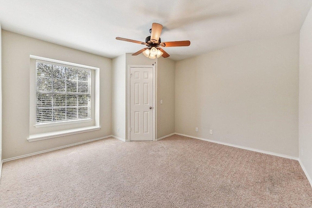 unfurnished bedroom with baseboards, carpet, and ceiling fan