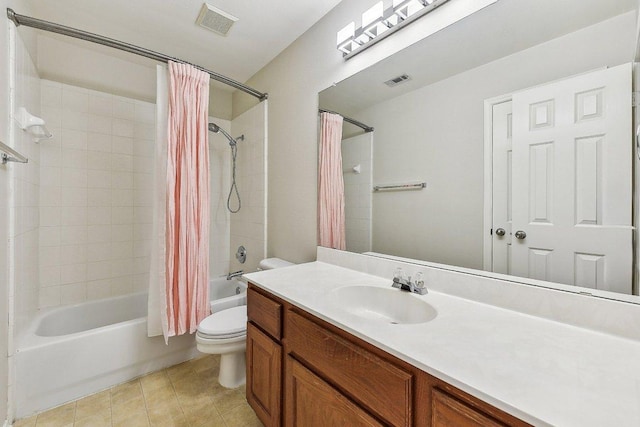 bathroom with visible vents, vanity, toilet, and shower / tub combo with curtain