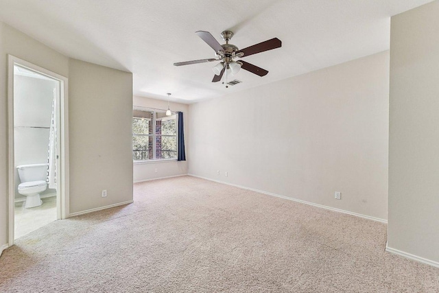 unfurnished bedroom featuring visible vents, baseboards, and carpet floors