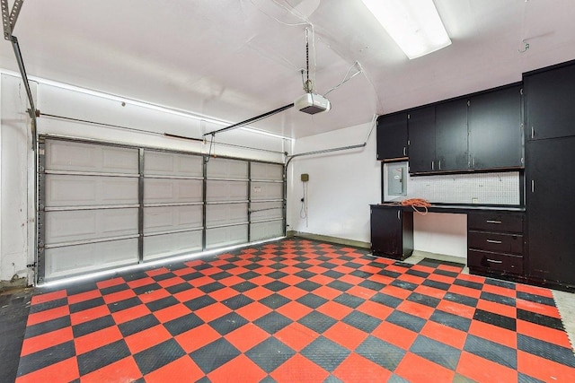 garage with electric panel and a garage door opener