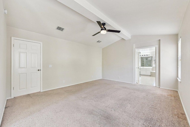 empty room with visible vents, lofted ceiling with beams, carpet, baseboards, and ceiling fan