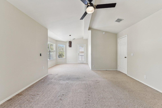 unfurnished living room featuring baseboards, visible vents, lofted ceiling, ceiling fan, and light carpet