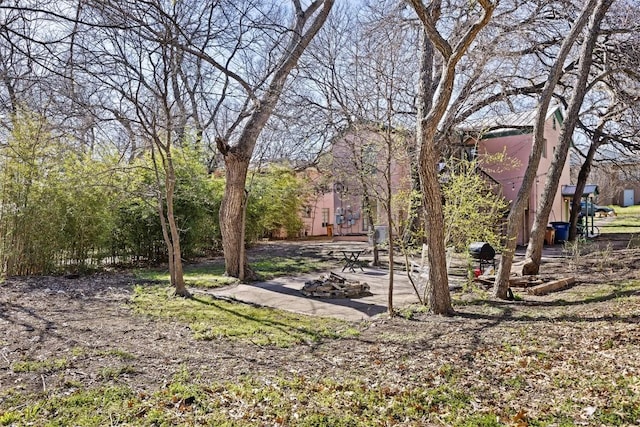 view of community featuring a fire pit