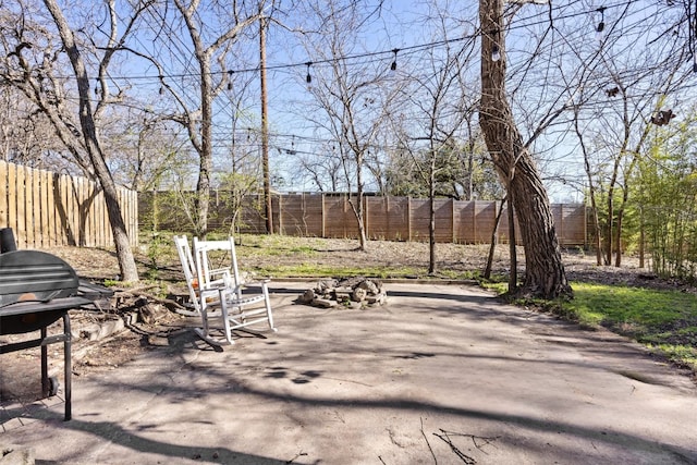 view of patio with a grill and a fenced backyard