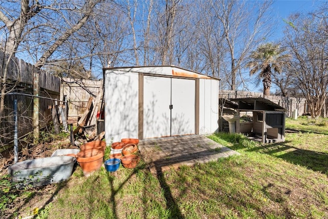 view of shed with fence