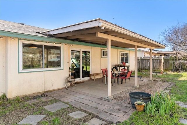 view of patio / terrace featuring fence