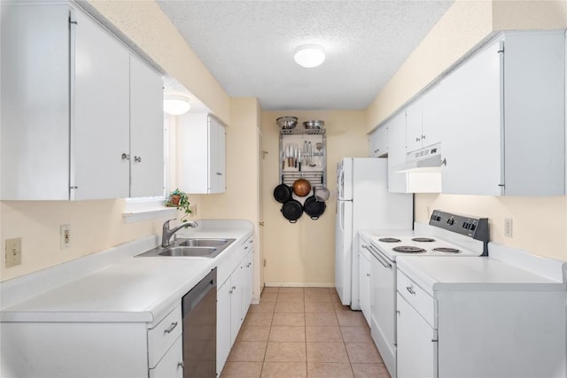 kitchen featuring white appliances, a sink, light countertops, white cabinets, and a textured ceiling