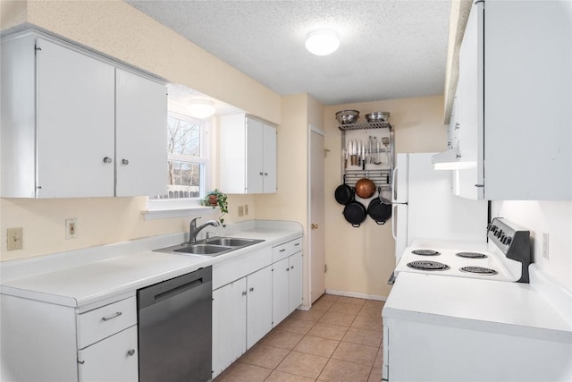 kitchen with white cabinets, white appliances, a textured ceiling, and a sink