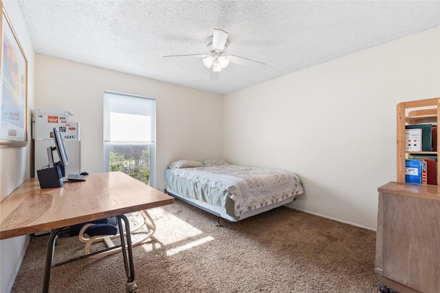 bedroom with carpet flooring, a textured ceiling, and a ceiling fan