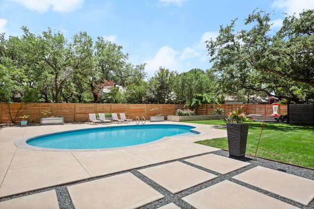 view of pool featuring a fenced in pool, a patio, a lawn, and a fenced backyard