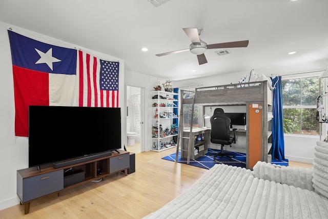 bedroom with recessed lighting, wood finished floors, visible vents, and baseboards