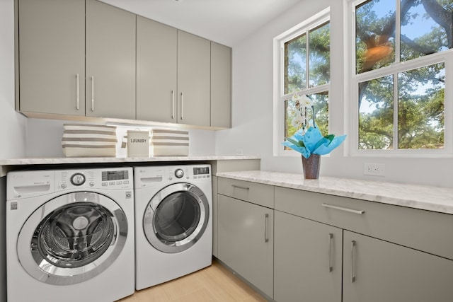 206 Duck Lake Dr, Lakeway, TX 78734 - washroom with separate washer and dryer, cabinet space, and light wood-type flooring