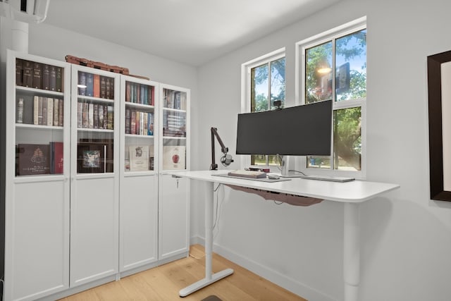 home office with light wood-type flooring