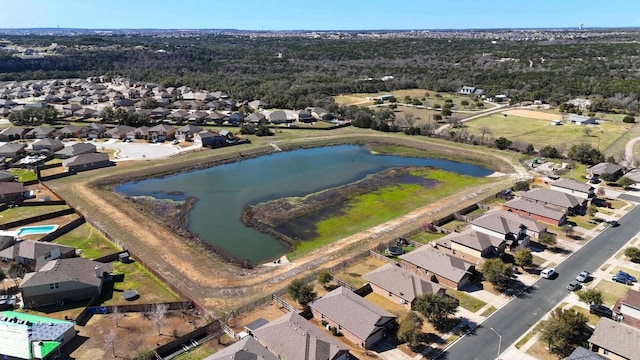 bird's eye view with a water view and a residential view