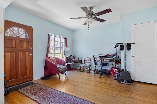 entrance foyer featuring wood finished floors and a ceiling fan