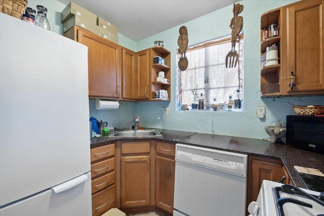 kitchen featuring open shelves, white appliances, brown cabinetry, and a sink