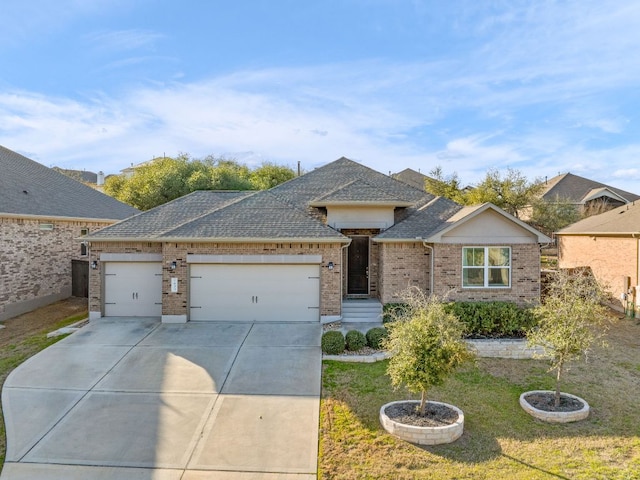 single story home with brick siding, a shingled roof, a front yard, driveway, and an attached garage