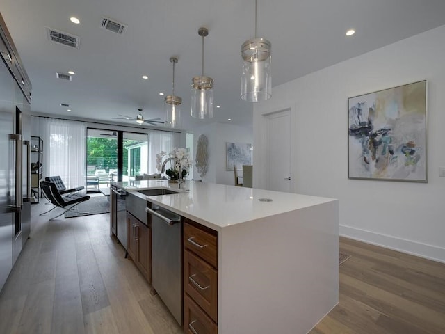 kitchen with visible vents, appliances with stainless steel finishes, and light wood-type flooring