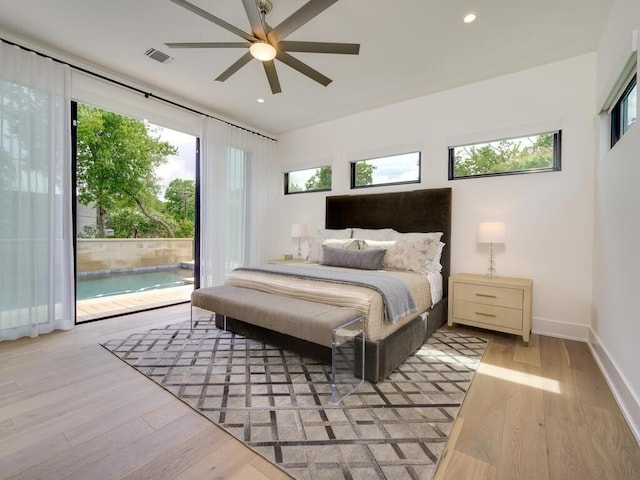 bedroom featuring visible vents, light wood finished floors, baseboards, recessed lighting, and access to outside