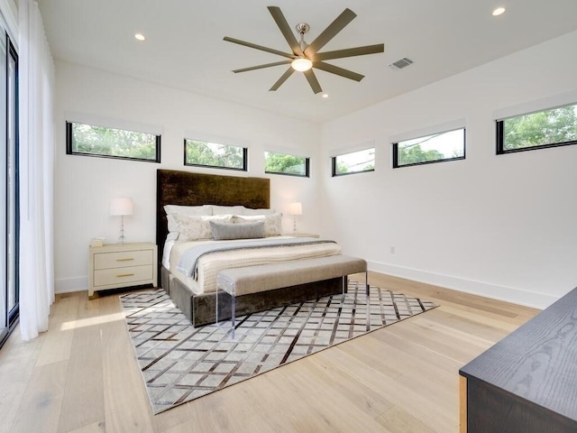 bedroom with recessed lighting, visible vents, and multiple windows