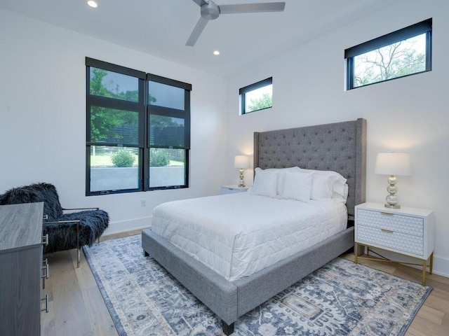 bedroom with recessed lighting, baseboards, light wood finished floors, and ceiling fan