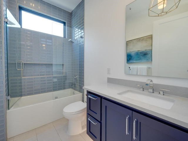 bathroom featuring vanity, toilet, shower / bathtub combination, and tile patterned flooring