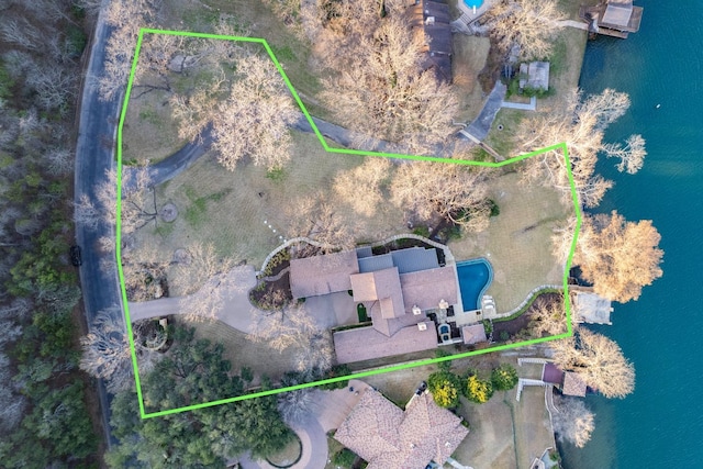 birds eye view of property featuring a water view