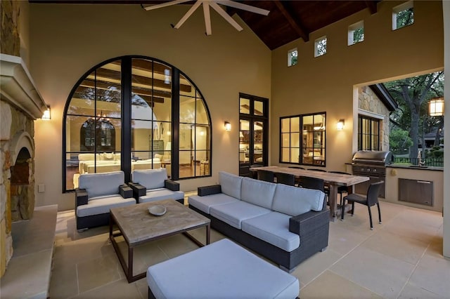 view of patio / terrace featuring an outdoor living space, an outdoor kitchen, and area for grilling