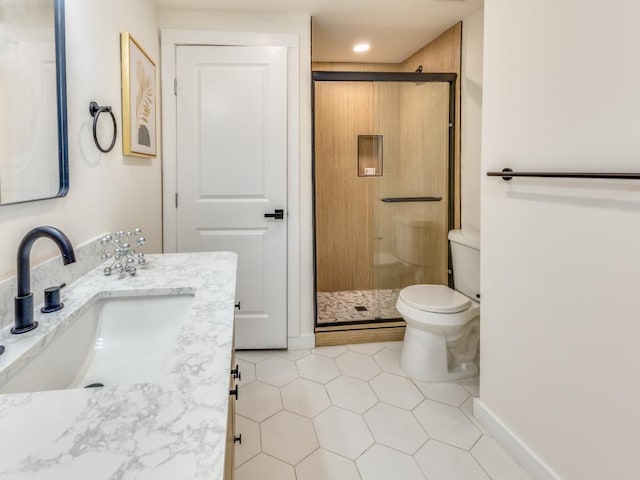 full bath featuring tile patterned flooring, a stall shower, toilet, and vanity