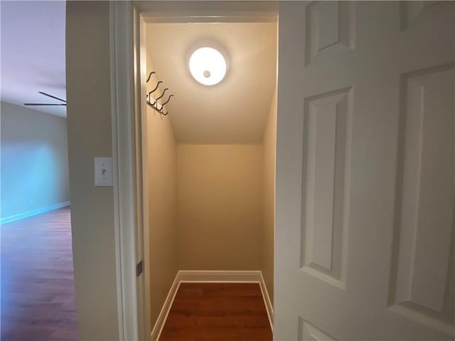 interior details featuring wood finished floors and baseboards