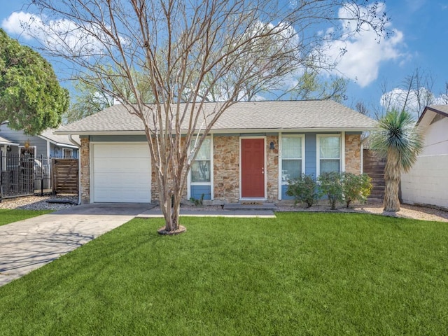 ranch-style home with fence, concrete driveway, a front yard, a shingled roof, and an attached garage