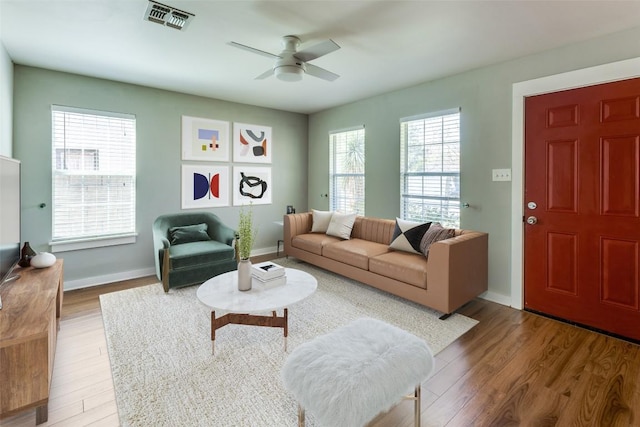 1105 Brookswood Ave, Austin, TX 78721 - living area featuring a ceiling fan and wood finished floors