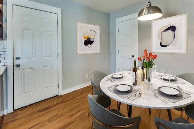 1105 Brookswood Ave, Austin, TX 78721 - dining space with wood finished floors and baseboards