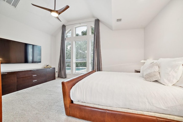 bedroom featuring vaulted ceiling, a ceiling fan, visible vents, and carpet floors