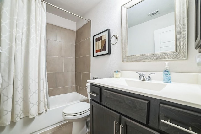 bathroom featuring vanity, shower / bath combination with curtain, toilet, and visible vents