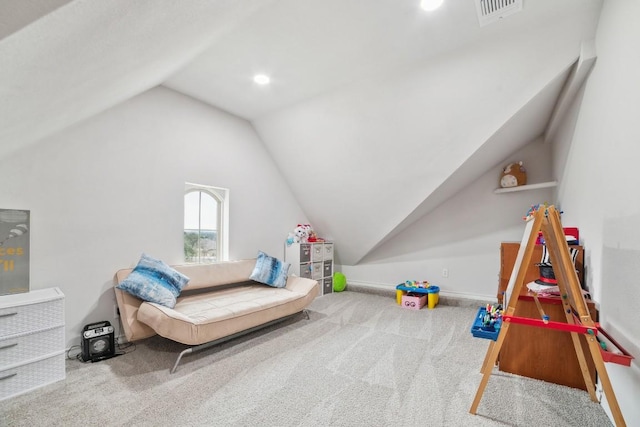 rec room featuring visible vents, carpet flooring, and vaulted ceiling