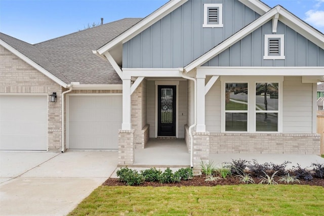 view of front of home with an attached garage, brick siding, a shingled roof, concrete driveway, and board and batten siding