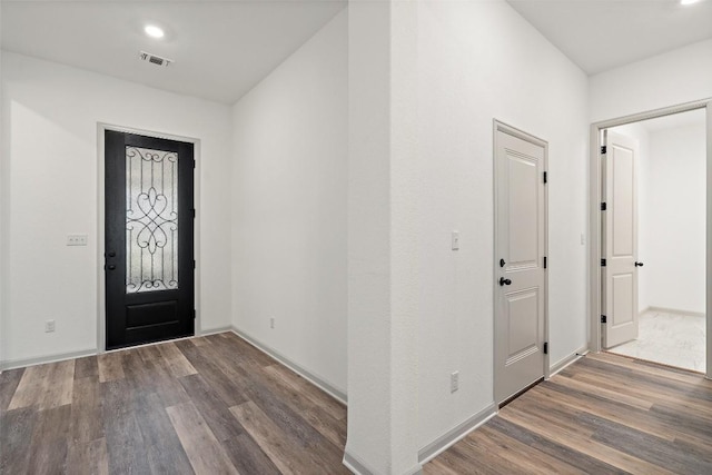 foyer entrance with visible vents, recessed lighting, baseboards, and wood finished floors