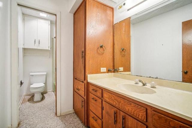 full bath with baseboards, toilet, and vanity