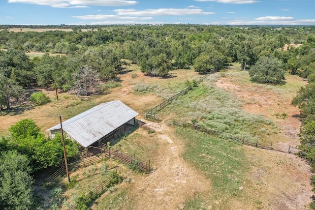 drone / aerial view featuring a view of trees