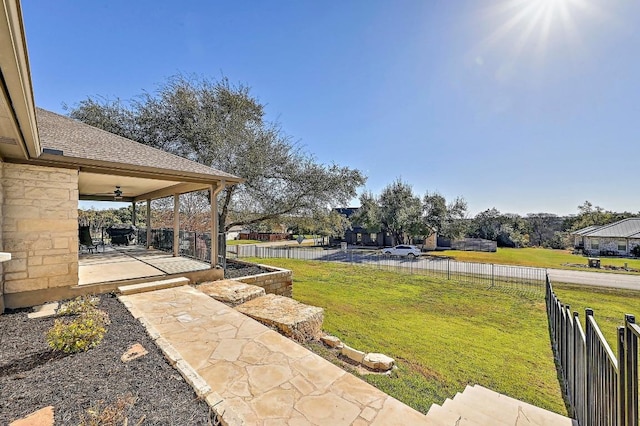 view of yard featuring a patio and fence